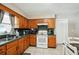 Functional kitchen with wood cabinets, durable countertops, and modern appliances for easy meal prep at 6663 Nw 60Th St, Ocala, FL 34482
