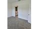 Neutral bedroom featuring plush carpet and an ensuite bathroom at 6841 Wilson Hammock Ave, Groveland, FL 34736