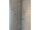 Modern shower featuring stylish gray tiles and a rainfall showerhead at 6841 Wilson Hammock Ave, Groveland, FL 34736