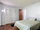 Comfortable bedroom with hardwood floors and ample storage with a closet for organized living at 700 E Mattie St, Sanford, FL 32773