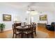 Elegant dining room with vaulted ceilings, classic furnishings, and beautiful hardwood floors for Gathering gatherings at 700 E Mattie St, Sanford, FL 32773