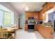 Well-equipped kitchen with stainless steel appliances, granite countertops, and ample storage space plus a breakfast nook at 700 E Mattie St, Sanford, FL 32773