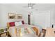 Cozy bedroom featuring a ceiling fan, closet, and access to the bathroom at 725 S Hampton Ave, Orlando, FL 32803
