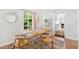 Bright dining area with natural wood table set and chairs, next to the kitchen at 725 S Hampton Ave, Orlando, FL 32803
