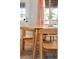 Cozy dining area with natural wood table set and chairs, with ample natural light at 725 S Hampton Ave, Orlando, FL 32803