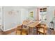Comfortable dining area featuring natural light, wooden floors, and seating for four at 725 S Hampton Ave, Orlando, FL 32803
