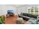 Cozy living room with modern decor, hardwood floors, comfortable seating, and ample natural light at 725 S Hampton Ave, Orlando, FL 32803