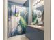 Bathroom featuring peacock-themed decor, a modern vanity, and a stylish shower curtain at 730 Siena Palm Dr # 201, Celebration, FL 34747