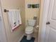 Cozy bathroom featuring neutral tones, wall art, and a decorative towel at 730 Siena Palm Dr # 201, Celebration, FL 34747