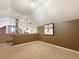 A carpeted bedroom offers a unique architectural detail and half wall at 730 Siena Palm Dr # 201, Celebration, FL 34747