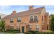 Charming two-story home with tile roof, green door, manicured landscaping, and stucco siding at 730 Siena Palm Dr # 201, Celebration, FL 34747