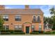Lovely home with a tile roof, manicured hedges, and an inviting green front door at 730 Siena Palm Dr # 201, Celebration, FL 34747