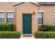 Inviting front door in a stucco home with manicured landscaping, a secure door, and great curb appeal at 730 Siena Palm Dr # 201, Celebration, FL 34747
