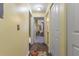 Inviting hallway with hardwood floors and a view into a bright, cozy living space at 730 Siena Palm Dr # 201, Celebration, FL 34747
