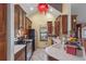 Traditional kitchen boasts wooden cabinets, stainless steel appliances, and ample counter space for cooking at 730 Siena Palm Dr # 201, Celebration, FL 34747