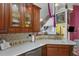 An inviting view of an updated kitchen with sleek countertops and wooden cabinets at 730 Siena Palm Dr # 201, Celebration, FL 34747