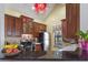 Traditional kitchen boasts wooden cabinets, stainless steel appliances, and ample counter space for cooking at 730 Siena Palm Dr # 201, Celebration, FL 34747
