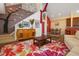 An entryway with a staircase and unique decor seamlessly connects to the cozy living room and dining area at 730 Siena Palm Dr # 201, Celebration, FL 34747