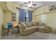 Bright living room features a comfortable sectional sofa, ceiling fan, and built-in storage at 730 Siena Palm Dr # 201, Celebration, FL 34747