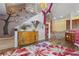 An entryway with a staircase and unique decor seamlessly connects to the cozy living room at 730 Siena Palm Dr # 201, Celebration, FL 34747
