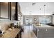The kitchen boasts granite countertops, dark cabinets, and an adjacent dining area at 750 Maple Leaf Loop, Winter Springs, FL 32708