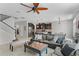 Cozy living area with kitchen, casual seating and natural lighting at 750 Maple Leaf Loop, Winter Springs, FL 32708