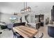 Open-concept living space with a kitchen island, dining table, and comfortable seating area at 750 Maple Leaf Loop, Winter Springs, FL 32708