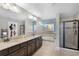 The main bathroom features dual sinks, a soaking tub, and a separate shower, offering a spa-like experience at 750 Maple Leaf Loop, Winter Springs, FL 32708