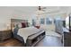 The primary bedroom features hardwood floors, a ceiling fan, and a tray ceiling. The room is spacious and well-lit at 750 Maple Leaf Loop, Winter Springs, FL 32708