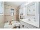 Clean bathroom with tub, shower, and classic vanity with built in cabinet at 7806 Compass Dr, Orlando, FL 32810