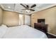 Cozy bedroom with a tray ceiling, ceiling fan, closet and access to ensuite bathroom at 7806 Compass Dr, Orlando, FL 32810