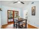 Eat-in dining area with wood floors and views of the outdoor patio through glass doors at 7806 Compass Dr, Orlando, FL 32810