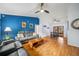 Spacious living room with wood floors, high ceilings, ceiling fans, and comfortable seating at 7806 Compass Dr, Orlando, FL 32810