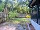 Fenced backyard with tropical landscaping and mature trees to maximize privacy at 830 Moonlit Ln, Casselberry, FL 32707
