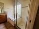 Bathroom with a large bathtub and a separate glass-enclosed shower stall at 830 Moonlit Ln, Casselberry, FL 32707