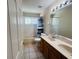 Bathroom with dual sink vanity, shower with tub, and neutral color scheme at 830 Moonlit Ln, Casselberry, FL 32707