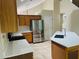 Charming kitchen offering wooden cabinets, quartz countertops, and stainless steel appliances at 830 Moonlit Ln, Casselberry, FL 32707