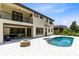 Beautiful backyard with a private pool, fire pit, and covered patio perfect for outdoor entertaining and relaxation at 8480 Adalina Pl, Orlando, FL 32827