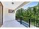 Enjoy the serene view from this balcony overlooking the pool and lush greenery at 8480 Adalina Pl, Orlando, FL 32827
