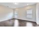 Well-lit bedroom with hardwood floors and minimalist design at 8480 Adalina Pl, Orlando, FL 32827
