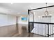 Second floor landing offering extra space for relaxation and recreation at 8480 Adalina Pl, Orlando, FL 32827