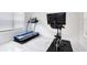 Bright workout room featuring a treadmill and a stationary bike, perfect for staying active at home at 8480 Adalina Pl, Orlando, FL 32827