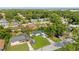 Aerial view of a neighborhood showcasing well-maintained homes and lush landscaping at 906 Kensington Dr, Orlando, FL 32808
