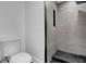 Bathroom featuring a modern tiled walk-in shower and a toilet at 906 Kensington Dr, Orlando, FL 32808
