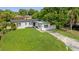 Charming single-story home with a well-manicured lawn and a welcoming exterior at 906 Kensington Dr, Orlando, FL 32808
