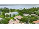 This luxury home boasts serene lake views and a sprawling landscape dotted with lush, mature trees at 9138 Great Heron Cir, Orlando, FL 32836