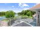 Balcony view overlooking lush landscaping and a serene lake at 9138 Great Heron Cir, Orlando, FL 32836