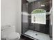 Tiled bathroom offers a glass-door shower and tiled shower and tile flooring at 9138 Great Heron Cir, Orlando, FL 32836