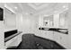 Elegant bathroom featuring black marble floor, double vanities, large mirrors, and custom cabinets at 9138 Great Heron Cir, Orlando, FL 32836