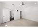 Bright bedroom featuring wood floors and access to another room at 9138 Great Heron Cir, Orlando, FL 32836
